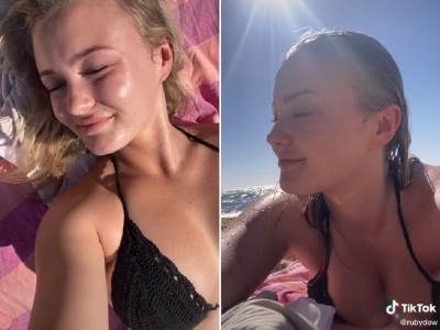  Devojka se sunča na plaži.jpg 